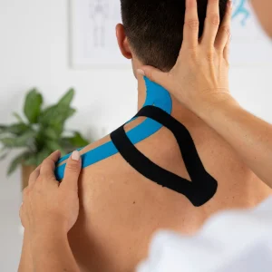 female-physiotherapist-applying-elastic-medical-bandage-male-patient female-physiotherapist-applying-elastic-medical-bandage-male-patient